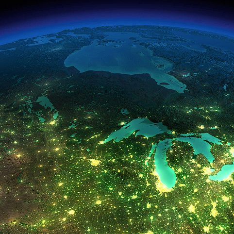 The Great Lakes at night, seen from space, with city lights across Wisconsin and the Midwest.
